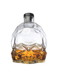 NUDE Memento Mori skull shaped whisky bottle filled front view