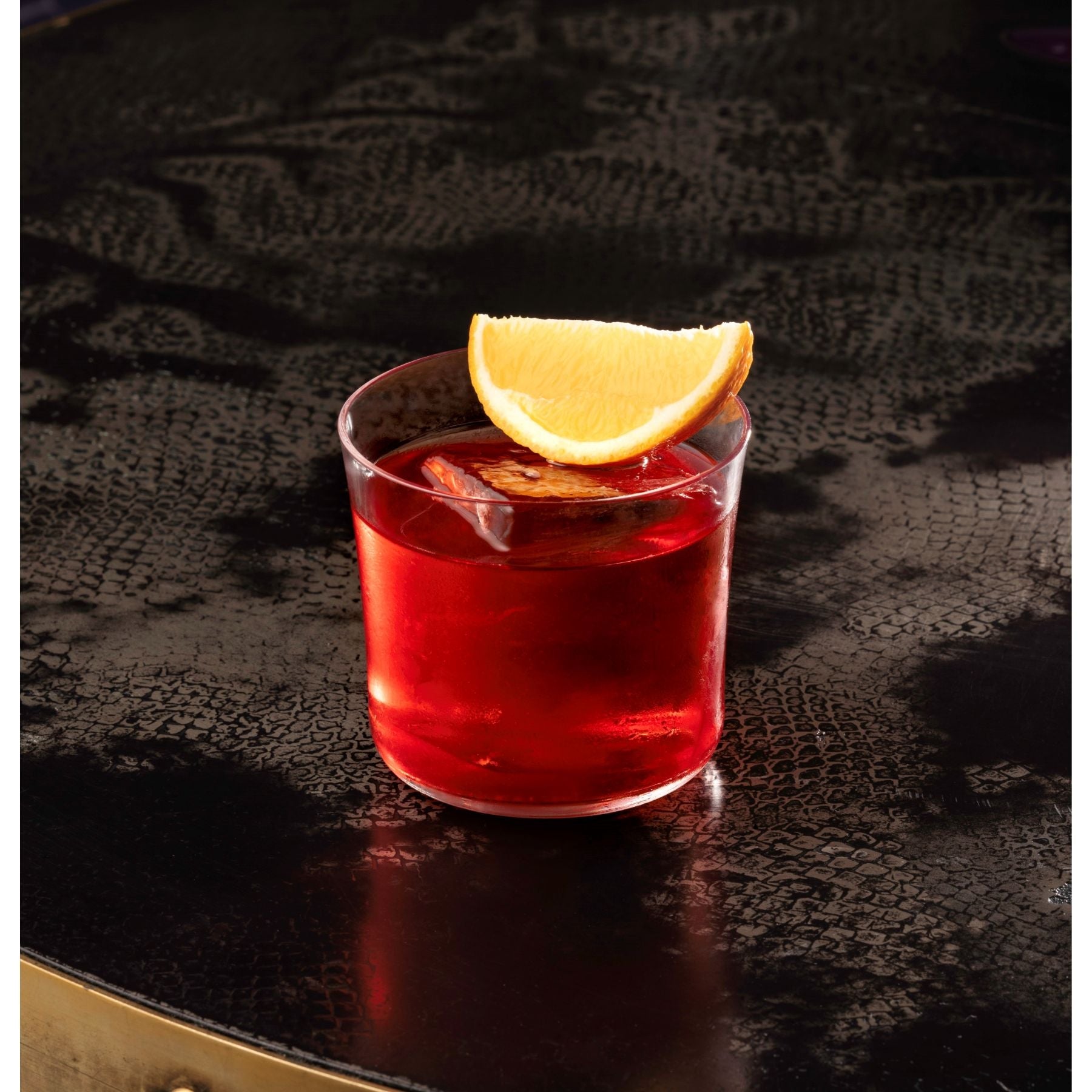 Lifestyle image of the NUDE Savage low ball glass designed by Remy Savage