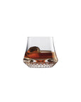 NUDE Paris whisky glass SOF, presented filled with whisky on a white background