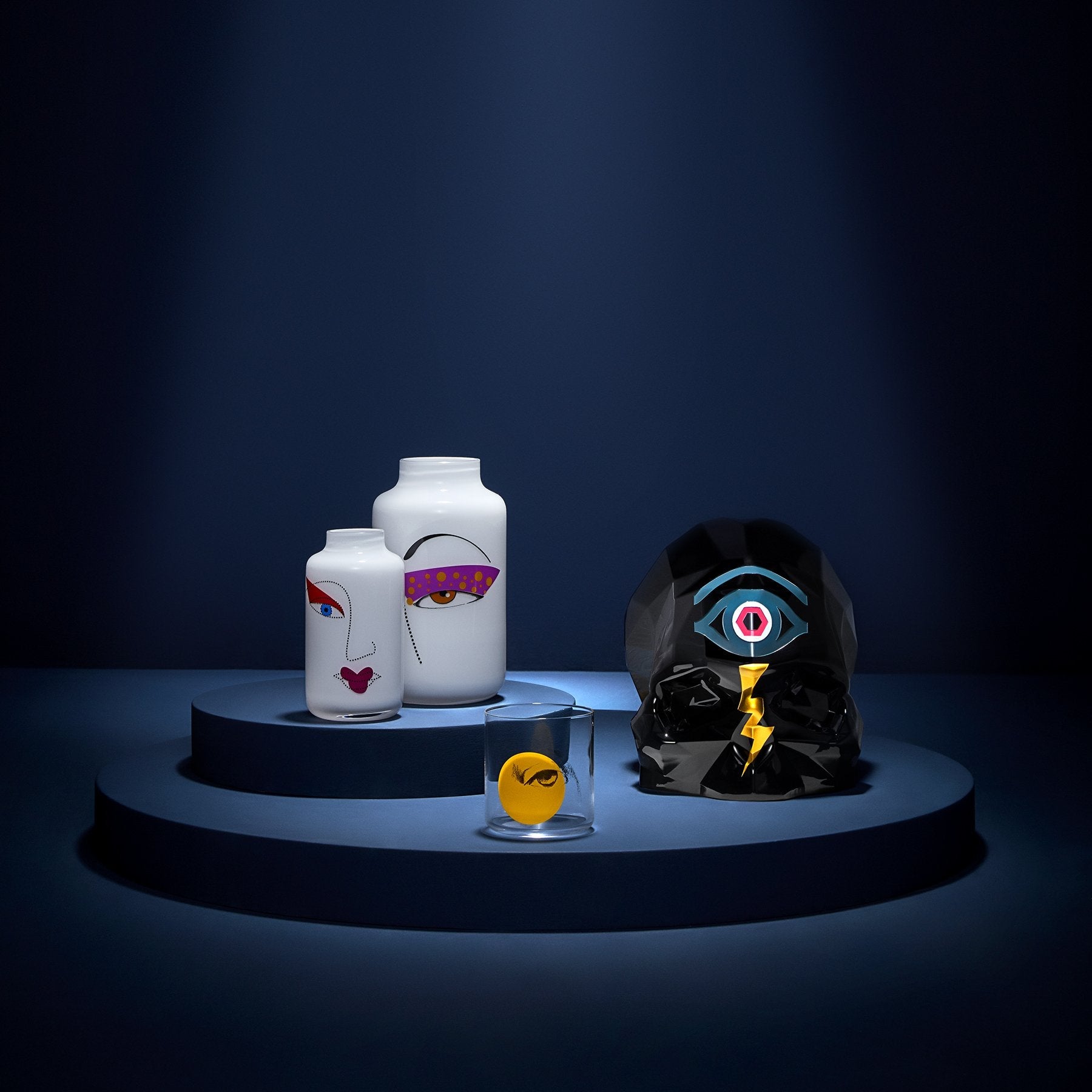 NUDE Mini Magnolia Rock & Pop vases diplayed within the collection in a dark blue lifestyle scenery