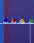 Lifestyle image of NUDE Rock & Pop glass collection with jug, highball glass and whisky glass in dark neon environment