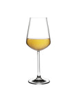 NUDE Salute white wine glass filled with white wine, lead-free crystal with a tapered rim on a white background