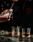 NUDE Caldera whisky glass filled being filled by mixologist in bar